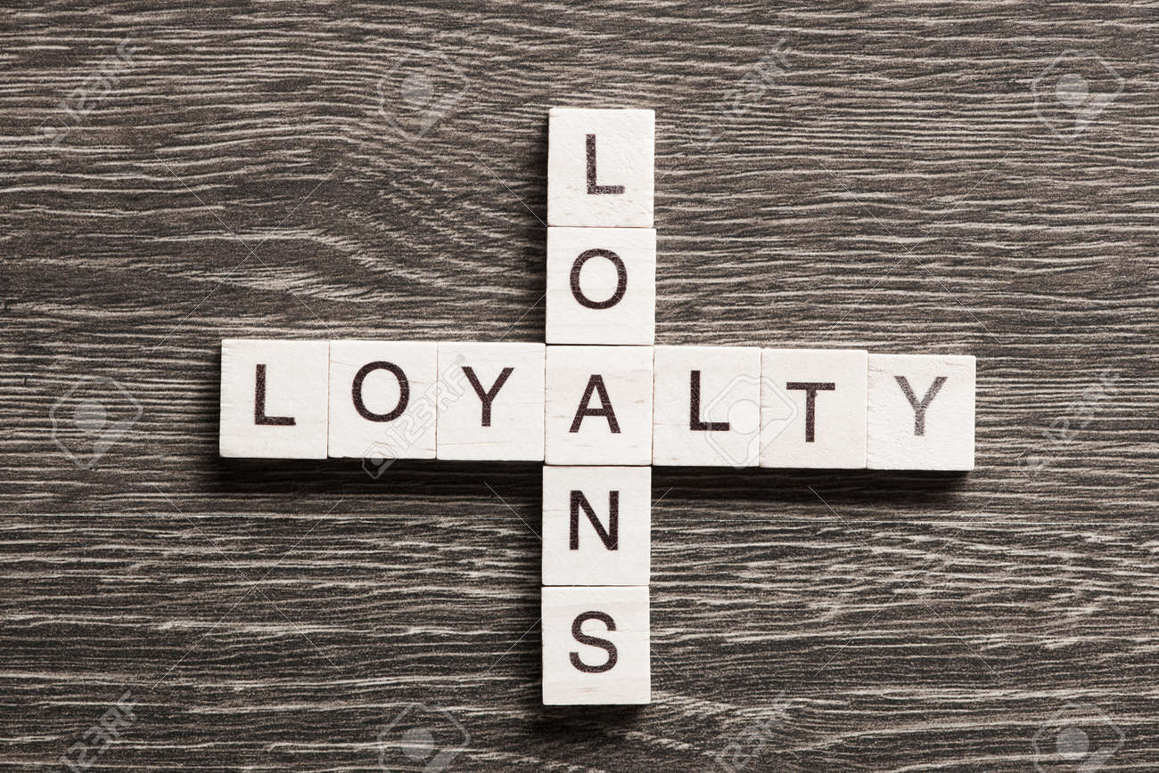 business workplace with loyalty loans words on table stock photo loans table