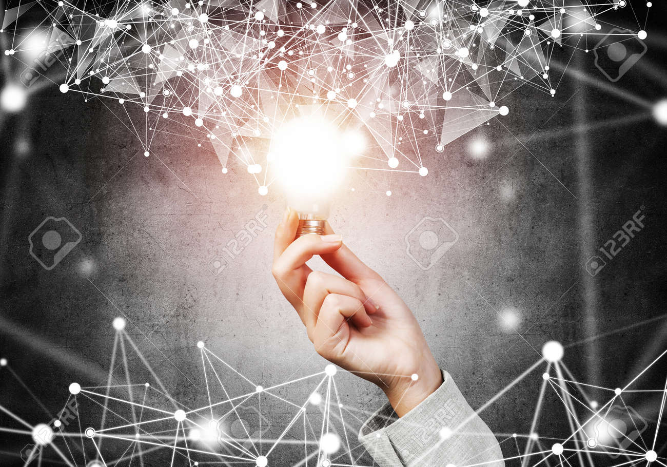 Woman hand with glowing lamp and abstract digital network connection on background of dark wall. Science research and innovation company. Global network technology and successful business solution. - 133426276 Woman hand with glowing lamp and abstract digital network connection on background of dark wall. Science research and innovation company. Global network technology and successful business solution. - 133426276