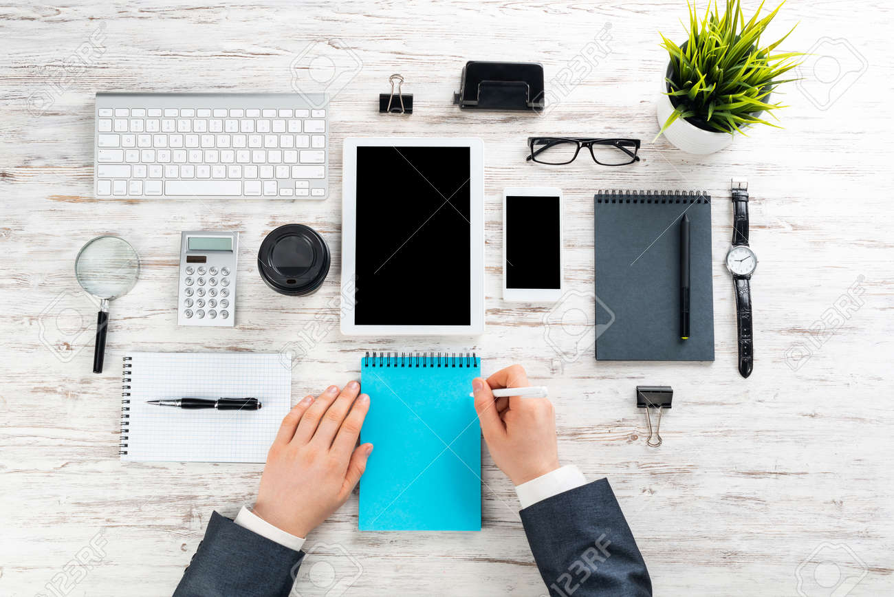 Businessman Writing In Notepad At Wooden Desk Well Organized Stock Photo Picture And Royalty Free Image Image Businessman Writing In Notepad At Wooden Desk Well Organized Stock Photo Picture And Royalty Free Image Image
