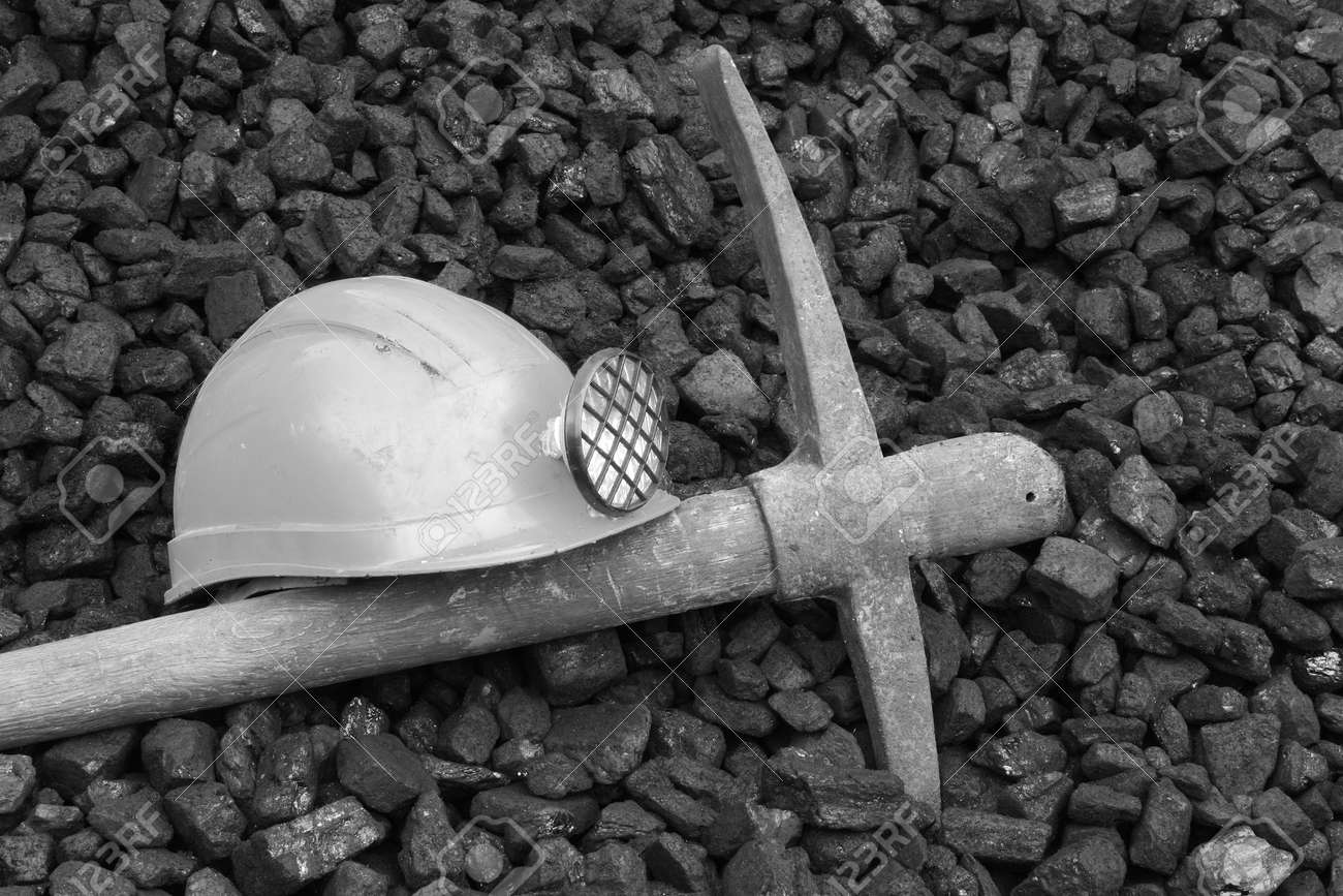 Photo helmet and pick commemorating the death of miners, black and white photo - 49180035 Photo helmet and pick commemorating the death of miners, black and white photo - 49180035