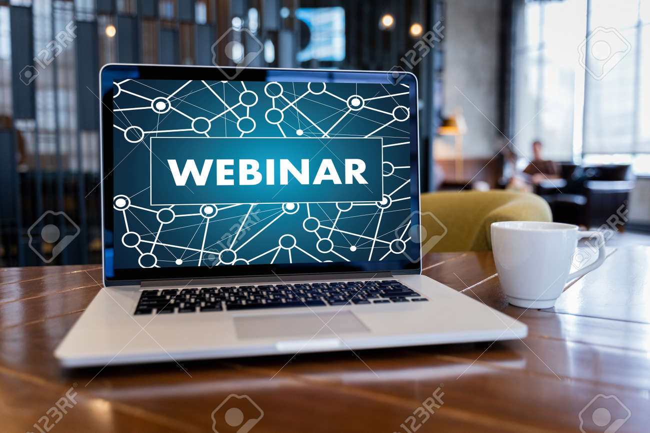 WEBINAR hand on table use E-business Browsing Connection in computer, coffee, Split tone - 107440793 WEBINAR hand on table use E-business Browsing Connection in computer, coffee, Split tone - 107440793
