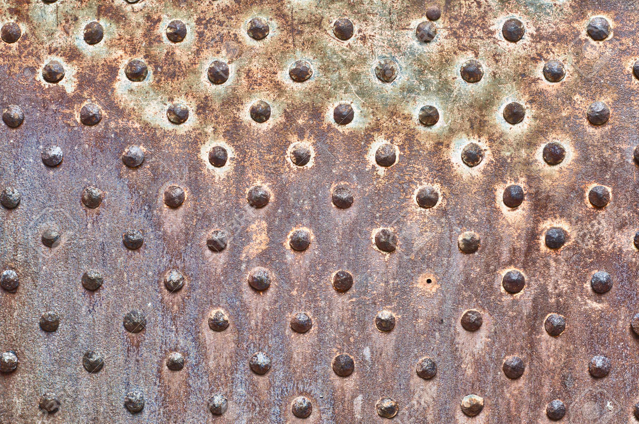 Rusty Metal Door rusty metal texture. studded iron plate. rivets on old, rusty Rusty Metal Door rusty metal texture. studded iron plate. rivets on old, rusty