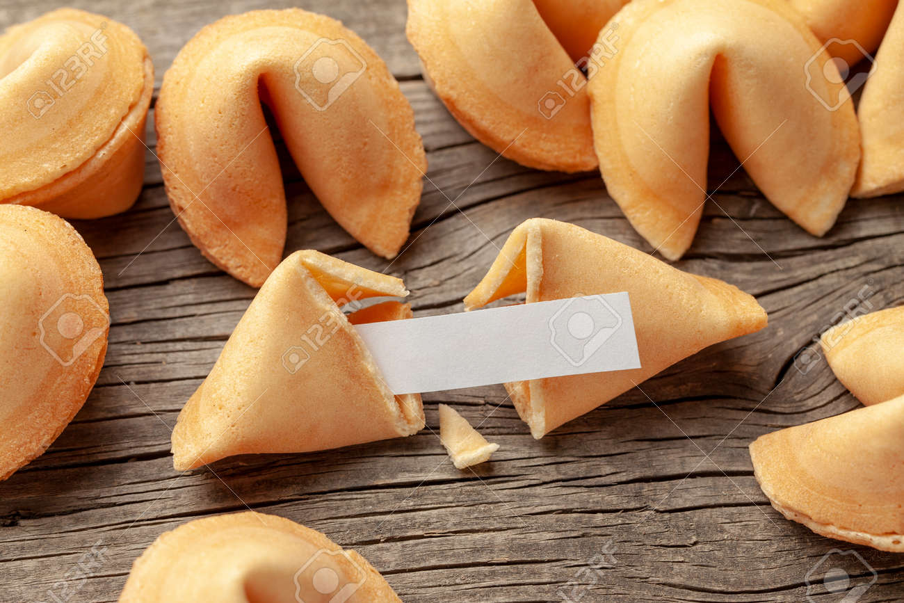 Chinese fortune cookies. Cookies pile with blank blank inside for words prediction. Background of old wooden table - 125294034 Chinese fortune cookies. Cookies pile with blank blank inside for words prediction. Background of old wooden table - 125294034