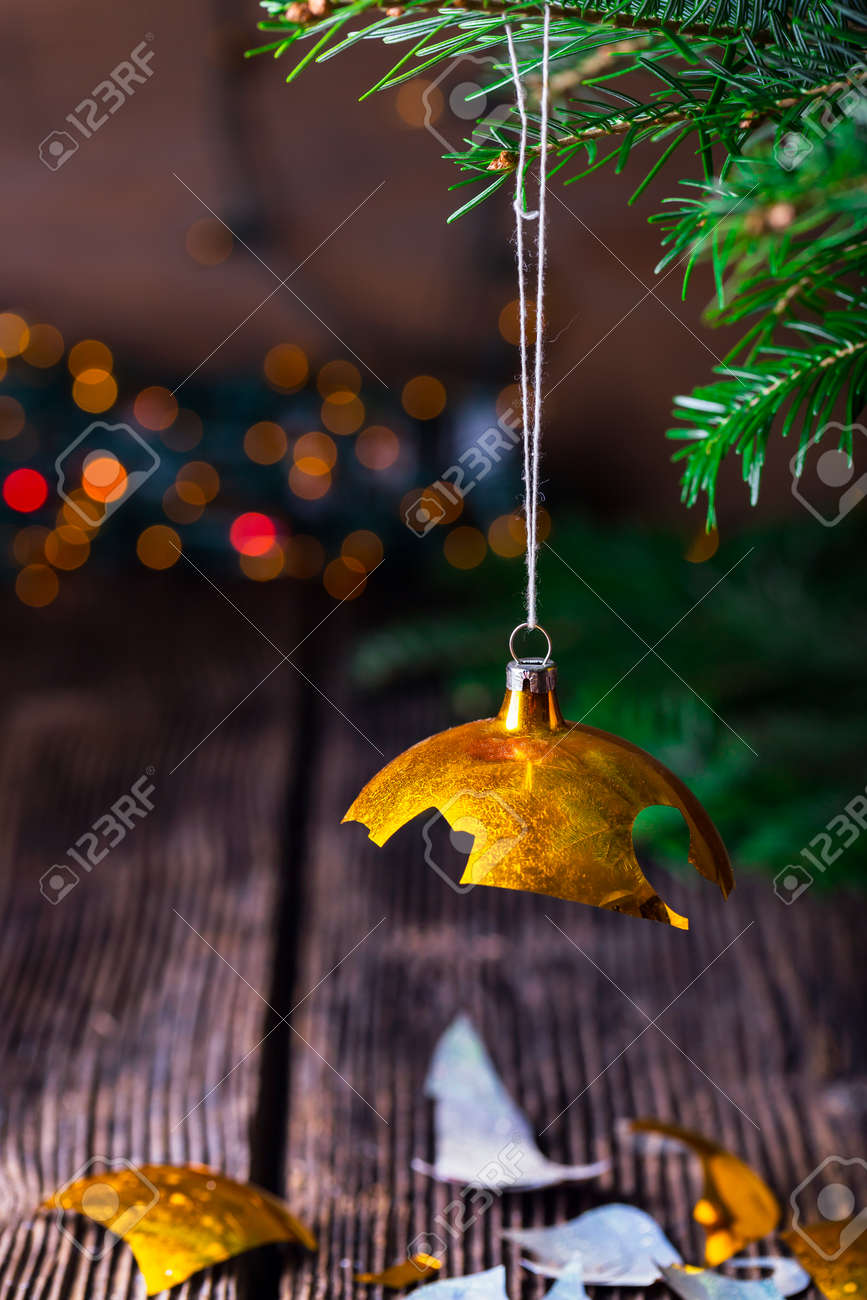 broken old vintage christmas ball on wooden table christmas stock