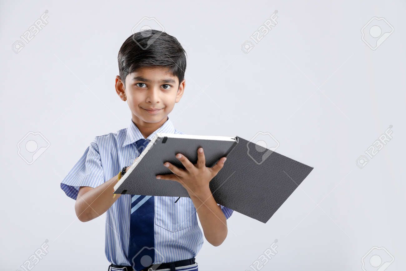 Indian / Asian School Boy With Note Book And Studying Stock Photo, Picture  and Royalty Free Image. Image 124441792., image size:1300x867