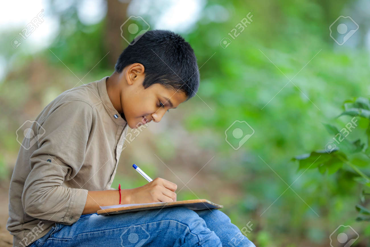 Indian Child Writing On Note Book Stock Photo, Picture and Royalty Free  Image. Image 154528308., image size:1300x867