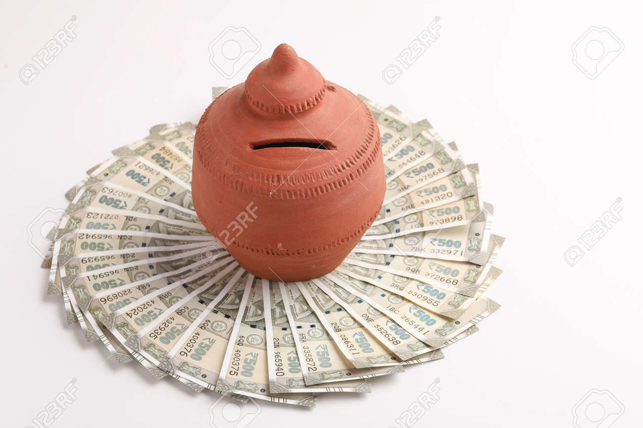 Clay Piggy Bank Pot With Five Hundred Rupees Bank Note In Indian Currency  On White Background Stock Photo, Picture and Royalty Free Image. Image  163015149.