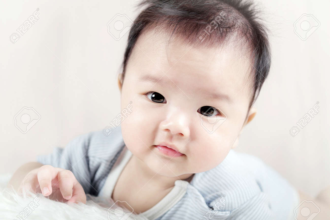 42809242-asian-baby-boy-lying-on-bed.jpg