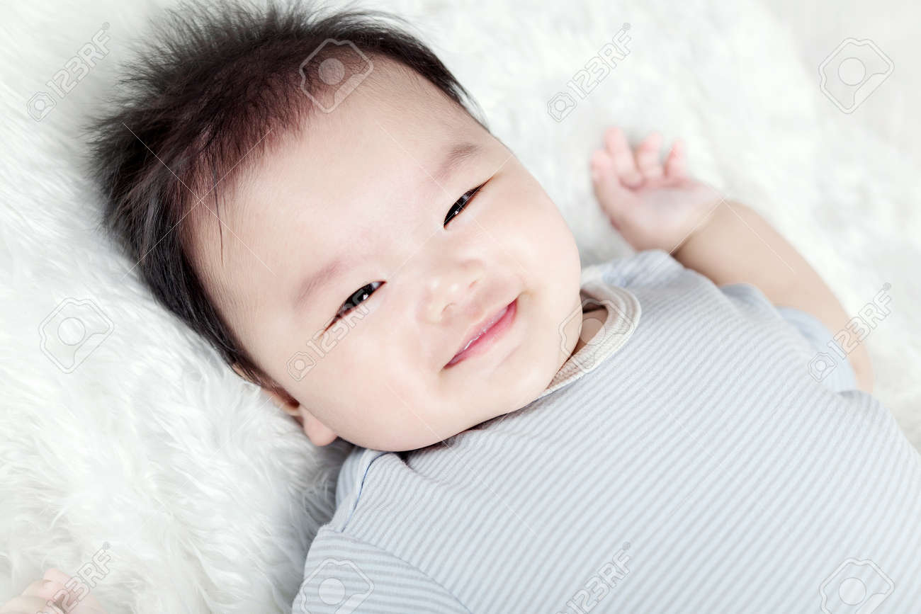 Asian Baby Boy Lying On Bed Stock Photo Picture And Royalty Free Image Image