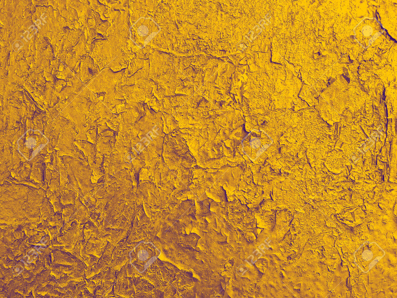 texture of old wall with a cracked golden paint vintage craquelure old paint
