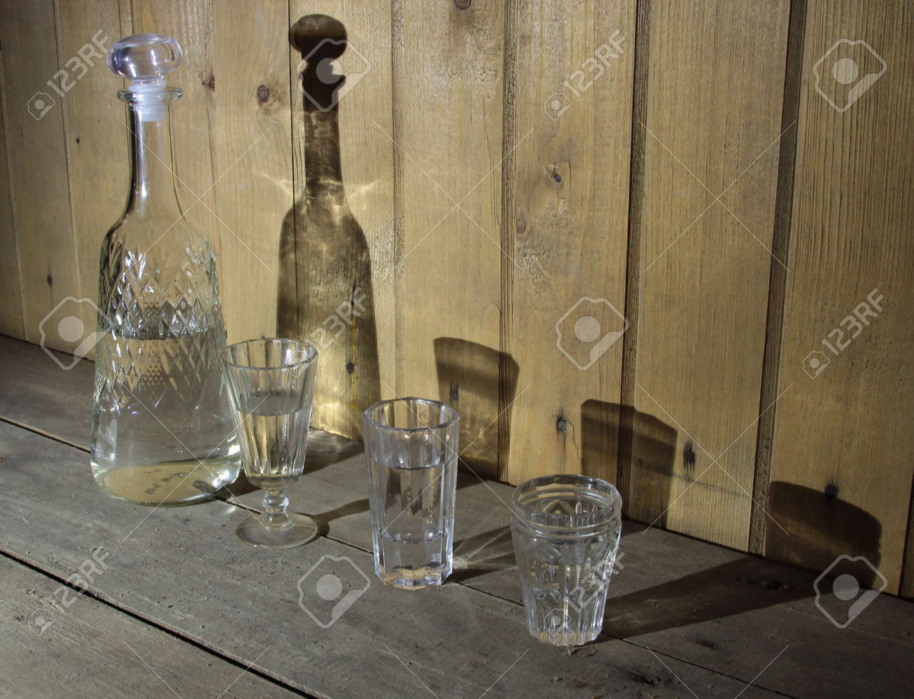 15814877-Decanter-and-3-vodka-glasses-Stock-Photo.jpg