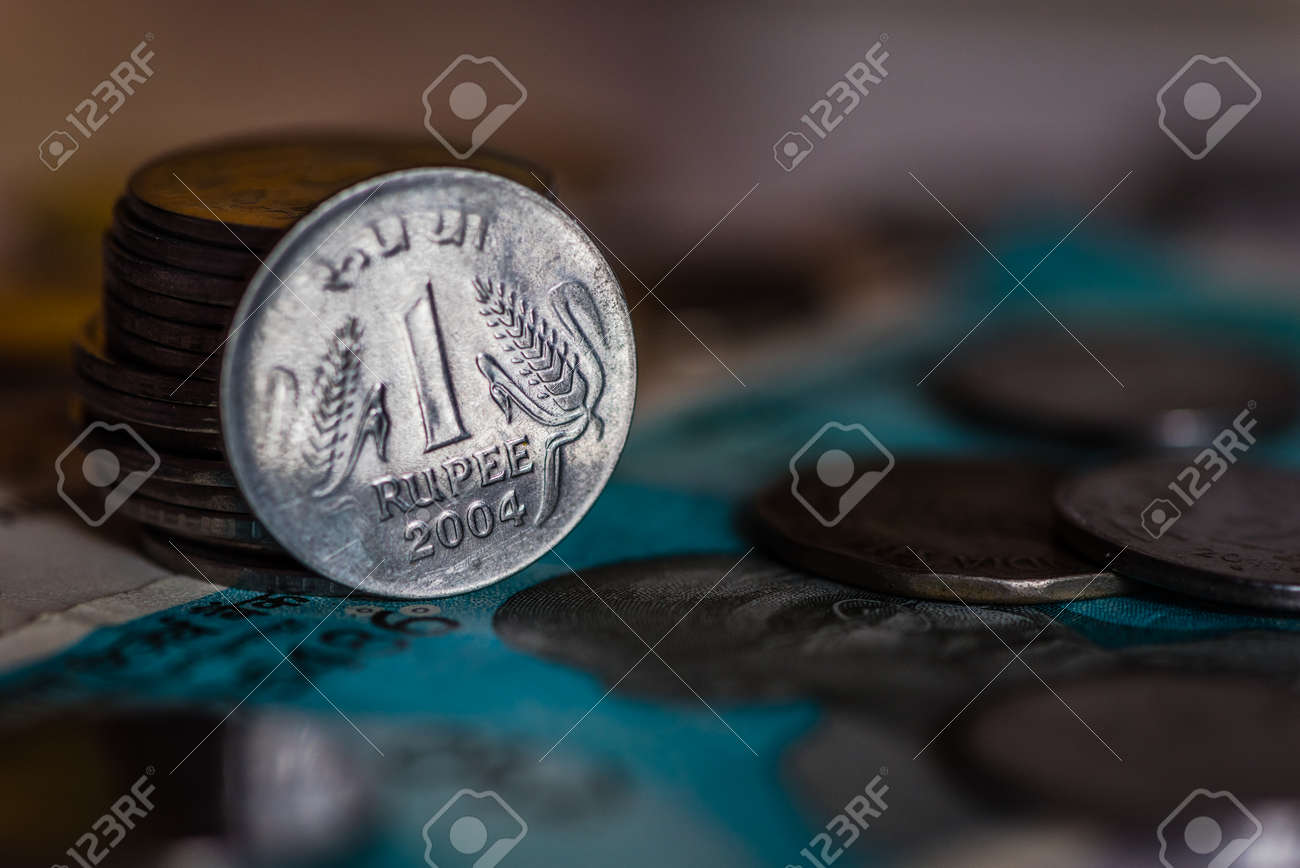 Indian Currency Coines Of Rs. One Isolated On Currency Note Stock Photo,  Picture and Royalty Free Image. Image 105688119.