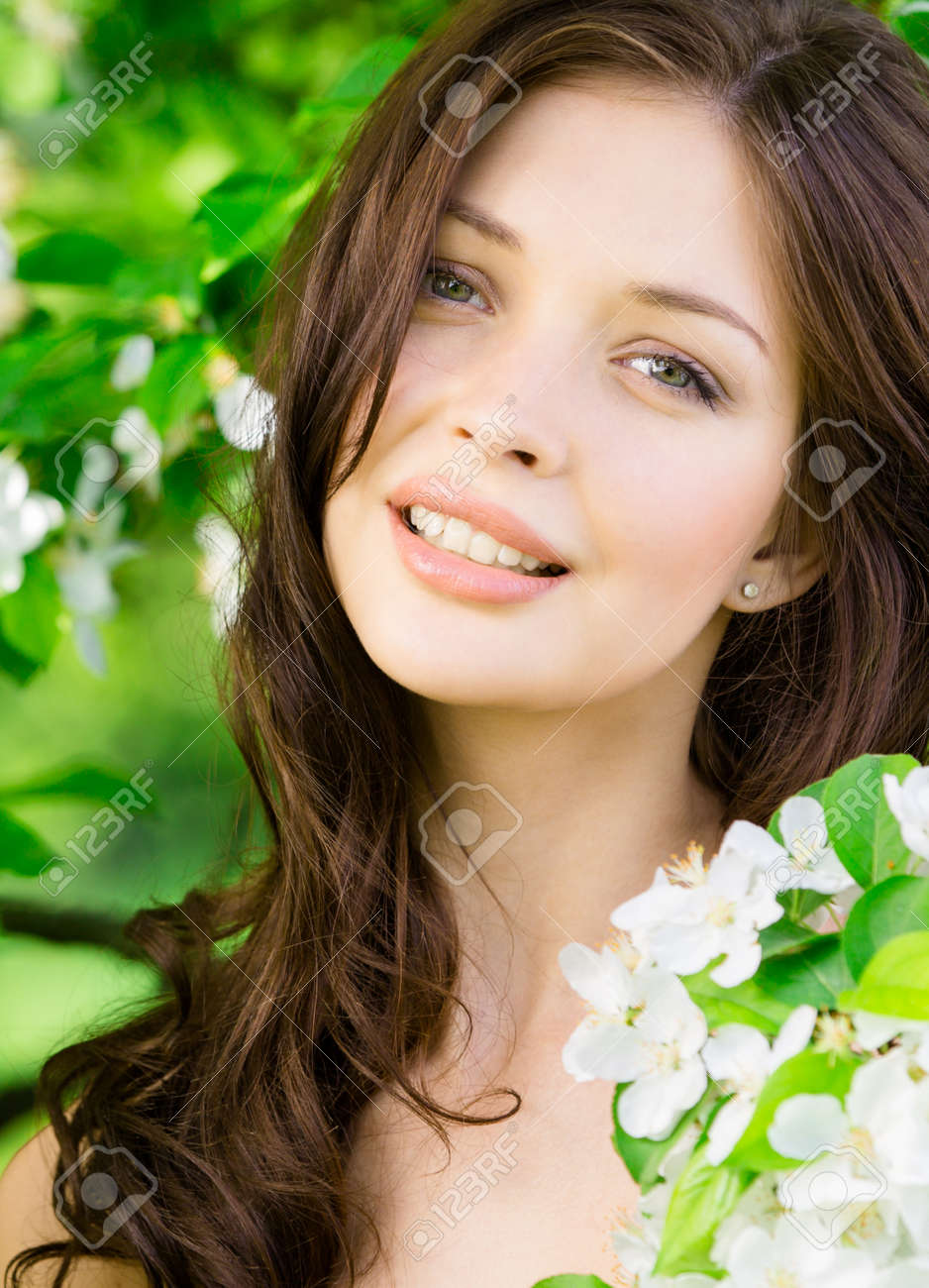 Portrait Of Beautiful Woman Near The Flowered Tree In The Park Stock Photo Picture And Royalty Free Image Image
