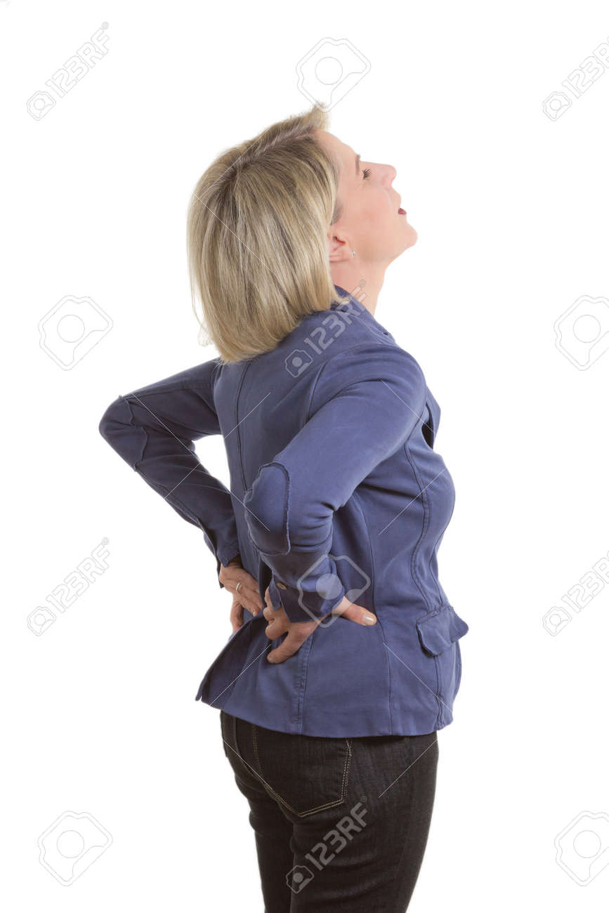 Woman with low back pain because of a pulled muscle, isolated, copy space - 26189173 Woman with low back pain because of a pulled muscle, isolated, copy space - 26189173