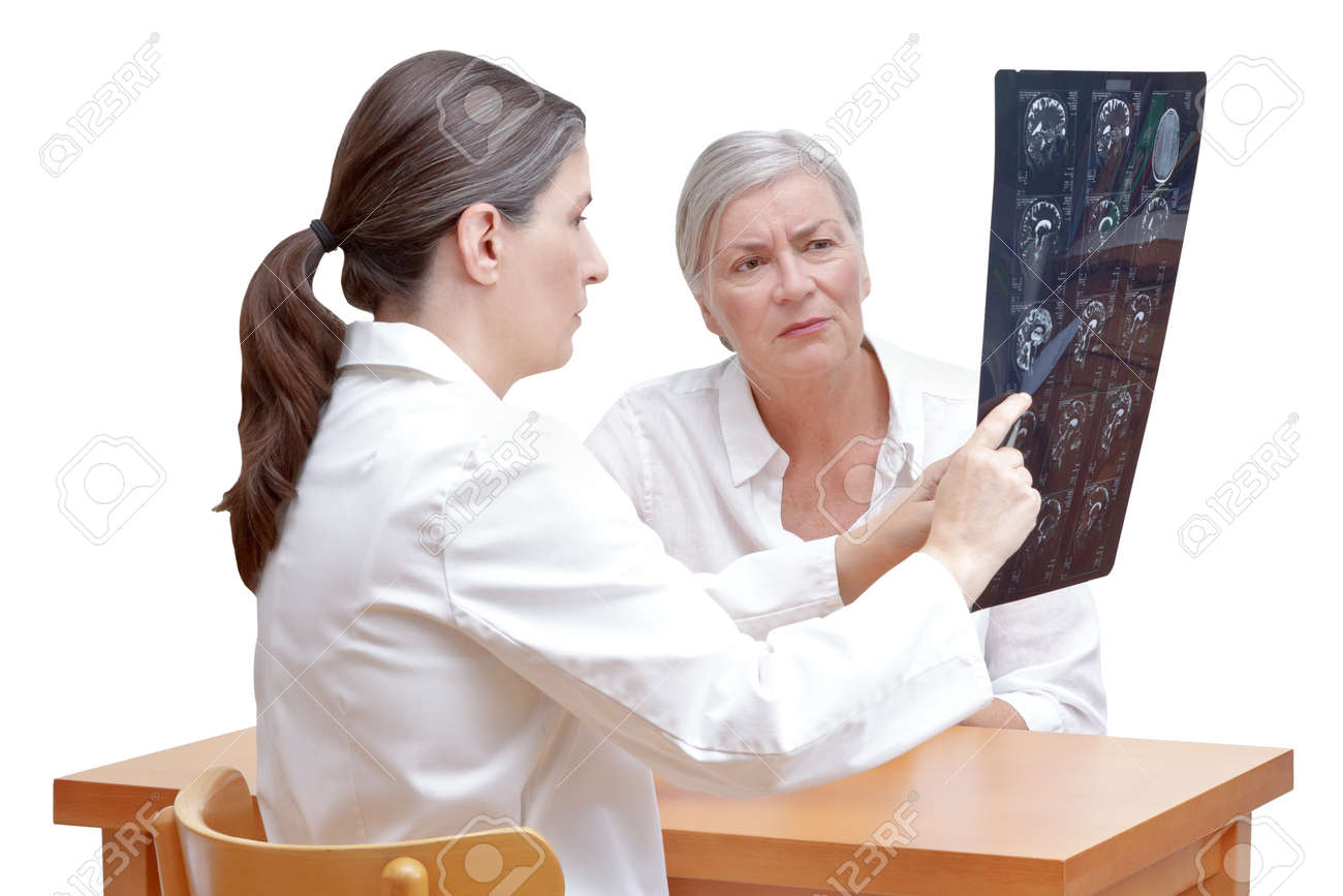 Female middle aged doctor showing her senior patient an mri of her head, isolated on white background - 86492951 Female middle aged doctor showing her senior patient an mri of her head, isolated on white background - 86492951