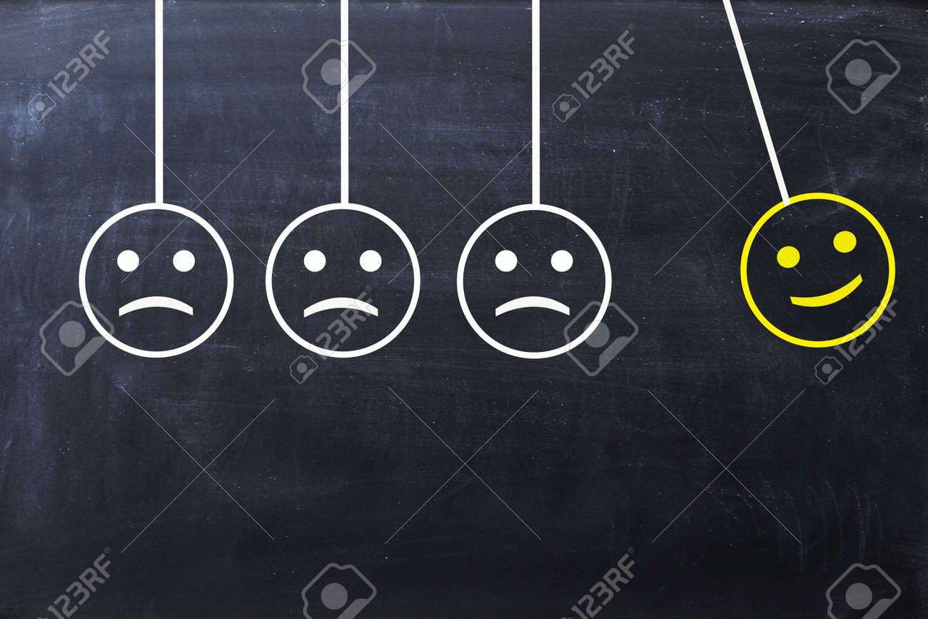 Spread Happiness Concept With Happy And Sad Faces On Newton S Stock Photo Picture And Royalty Free Image Image