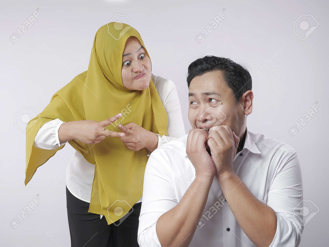 Portrait Of Funny Asian Muslim Couple Having Conflict, Wife And Husband Fight, Violence In Family, Husband Afraid To His Wife Concept Stock Photo, Picture And Royalty Free Image. Image 131686701. Portrait Of Funny Asian Muslim Couple Having Conflict, Wife And Husband Fight, Violence In Family, Husband Afraid To His Wife Concept Stock Photo, Picture And Royalty Free Image. Image 131686701.