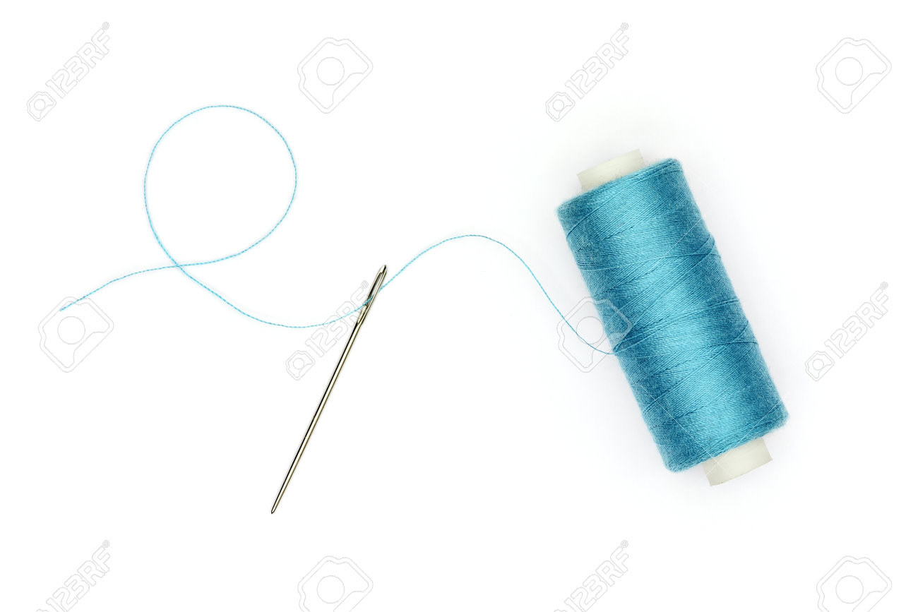 Sewing concept: Spool of blue thread with thread passing through the needle, cut out and isolated on white background. - 165250173 Sewing concept: Spool of blue thread with thread passing through the needle, cut out and isolated on white background. - 165250173