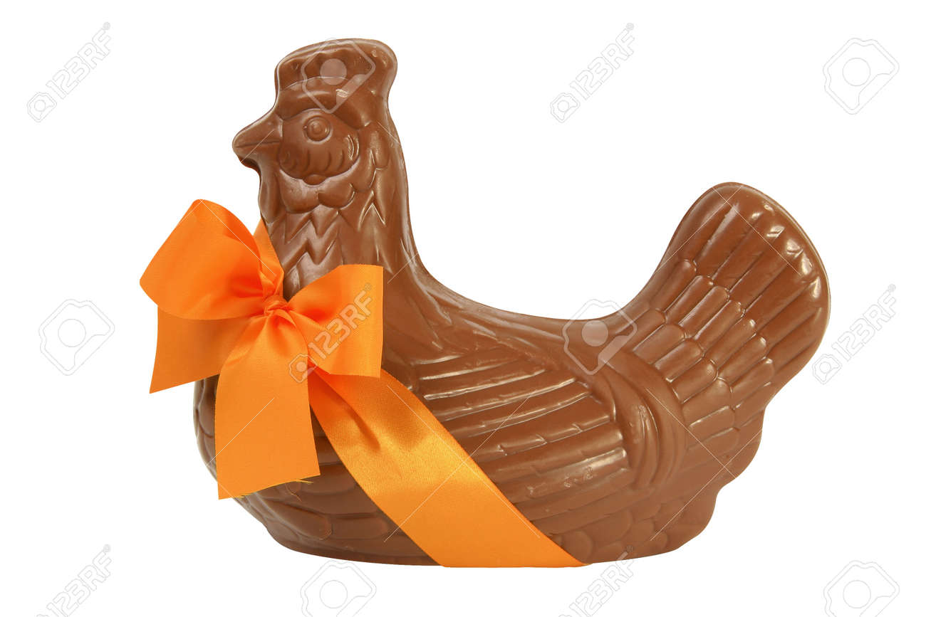 Chocolate Easter hen with orange ribbon, cut out and isolated on a white background - 166000612 Chocolate Easter hen with orange ribbon, cut out and isolated on a white background - 166000612