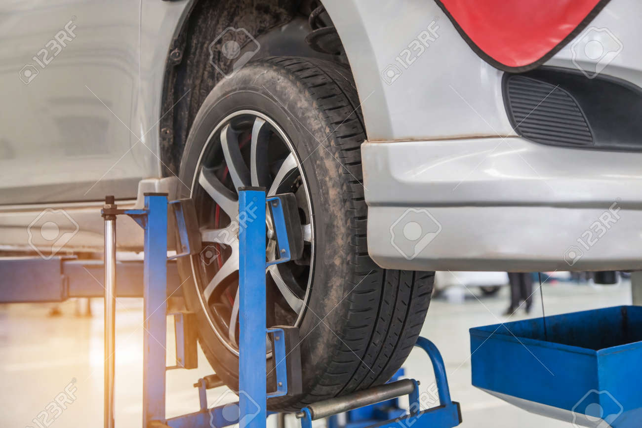Car On Lift To Repair Suspension In The Garage To Change Motor Stock Photo Picture And Royalty Free Image Image 85470003