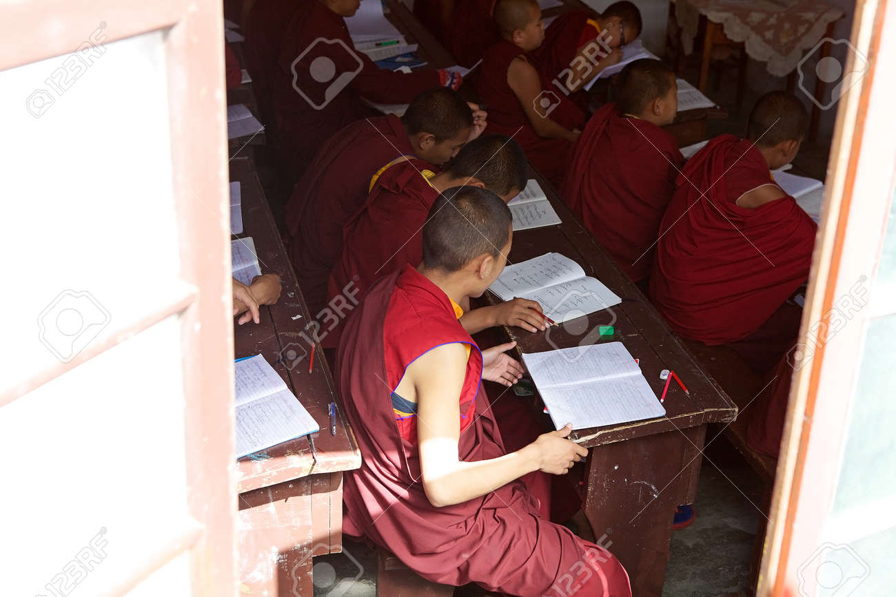 Buddhist Monks In Traditional Robes Are Studying In The Classroom