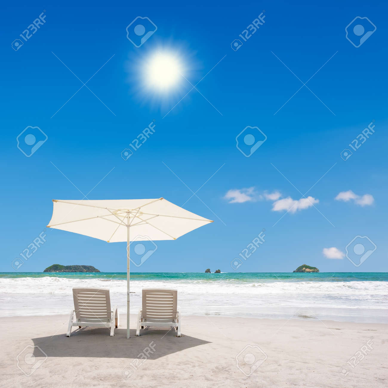 two chairs and umbrella at the beach manuel antonio costa rica