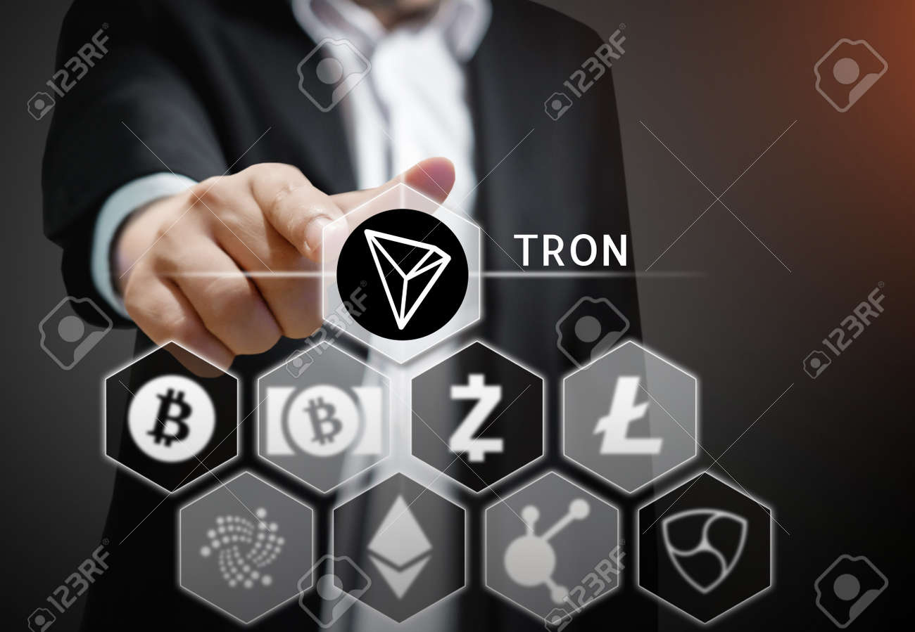 Business Man Points His Finger At Tron Coin Icon Among Others Stock Photo Picture And Royalty Free Image Image