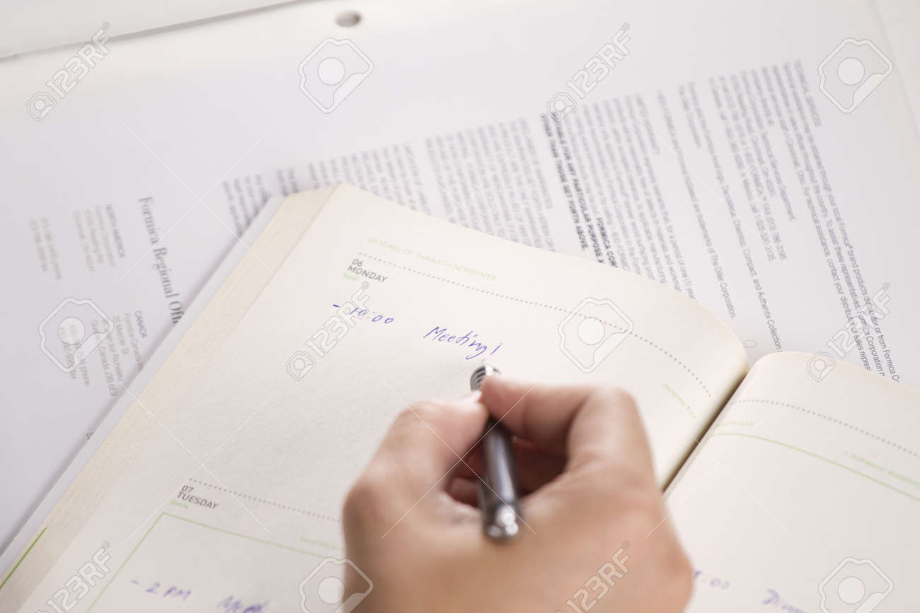 make schedule male hand writing schedule meeting on agenda stock make agenda