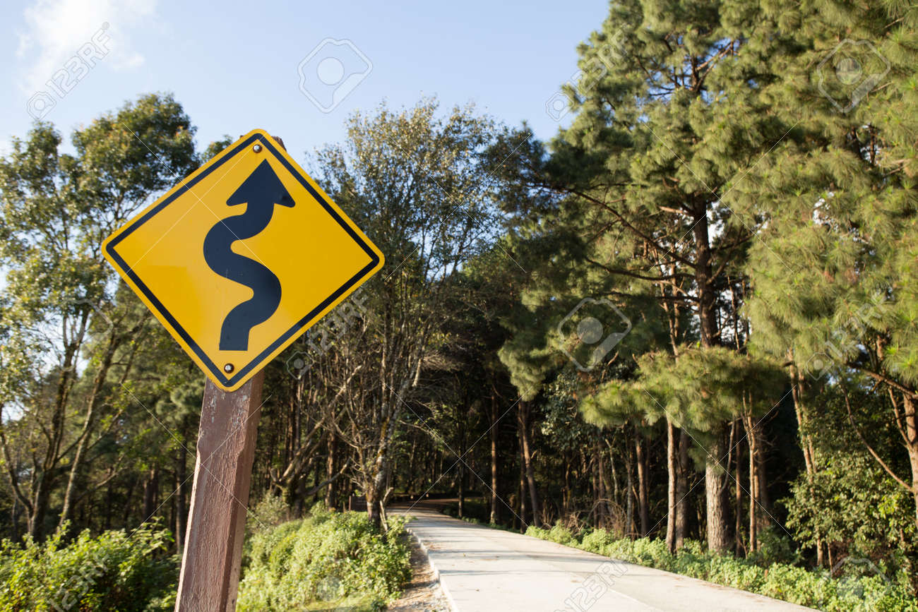 Winding Road Sign Yellow Winding Road Ahead Sign In Pine Wood Stock Photo Picture And Royalty Free Image Image