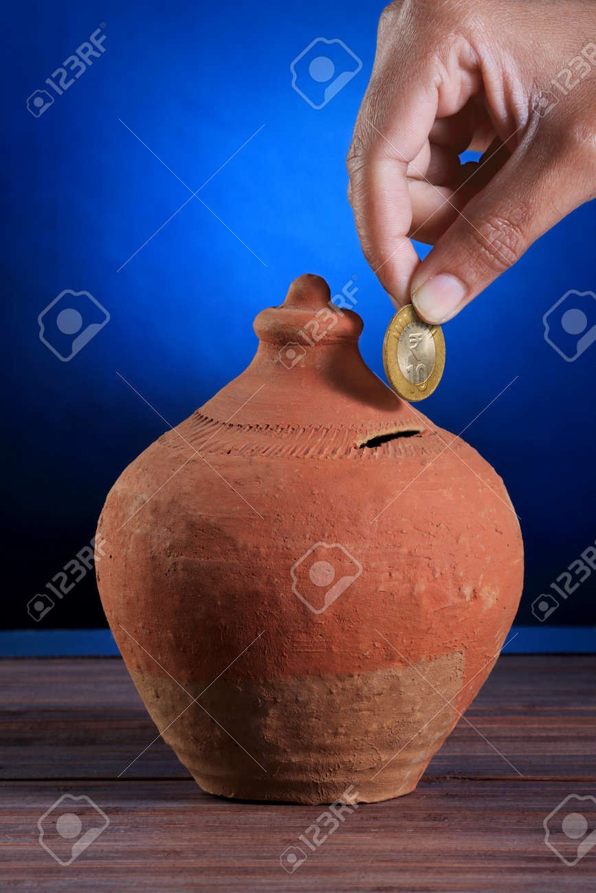 71040119-indian-rupee-coin-hand-made-pig