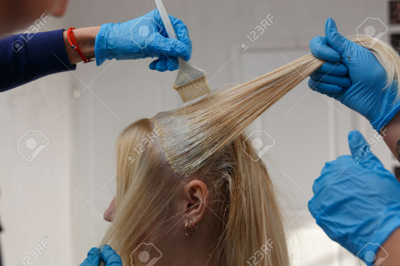 Hairdresser Salon Hair Colouring In Process Woman Dyeing Hairs