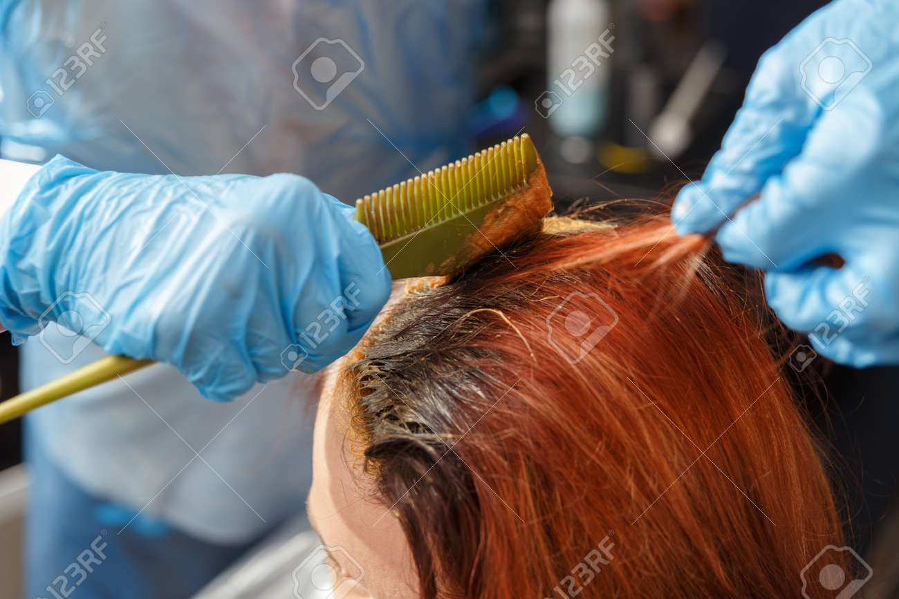 Hairdresser Salon Hair Colouring In Process Woman Dyeing Hairs