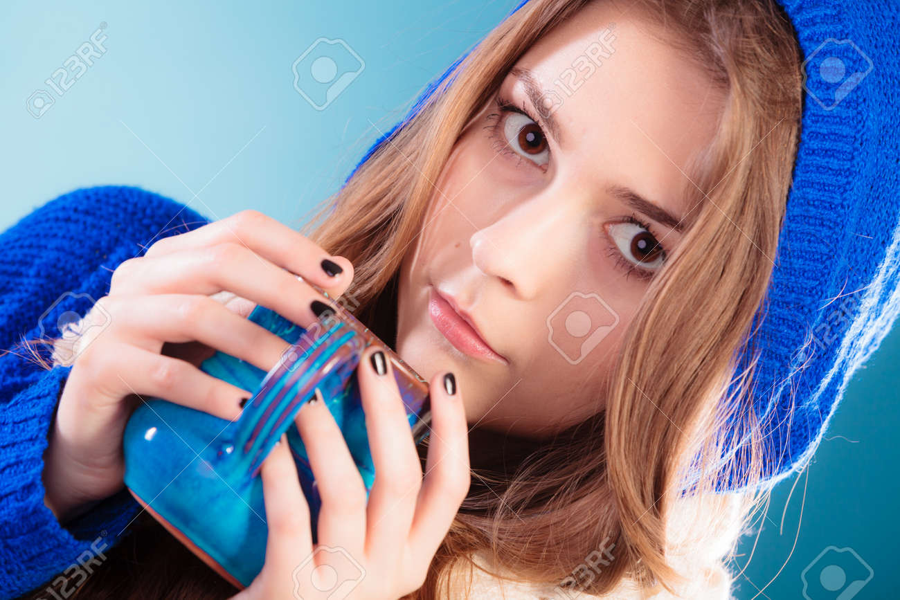 Hot Beverage Closeup Teen Girl Holding Blue Mug With Drink Tea Or Coffee Woman Hot Beverage Closeup Teen Girl Holding Blue Mug With Drink Tea Or Coffee Woman