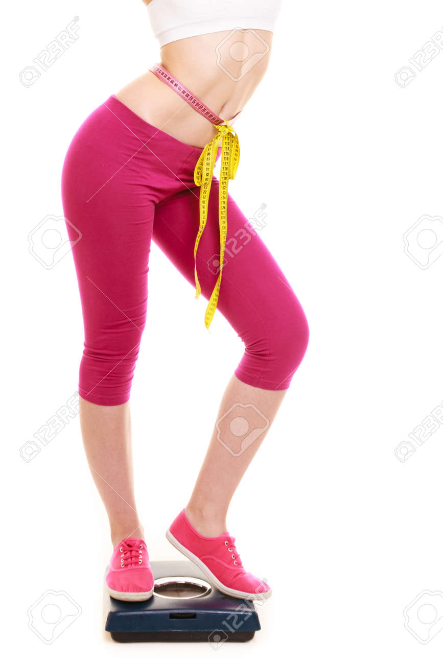 slimming and weight loss woman girl measuring waist with tape measure for weight loss