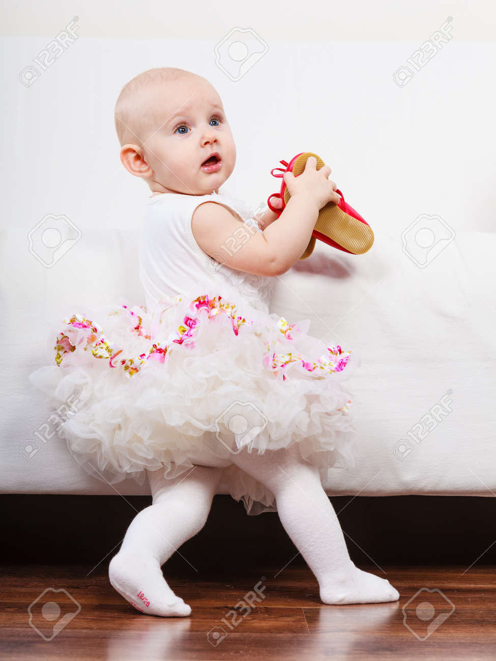 lesson of walking sweet adorable baby girl making steps at home