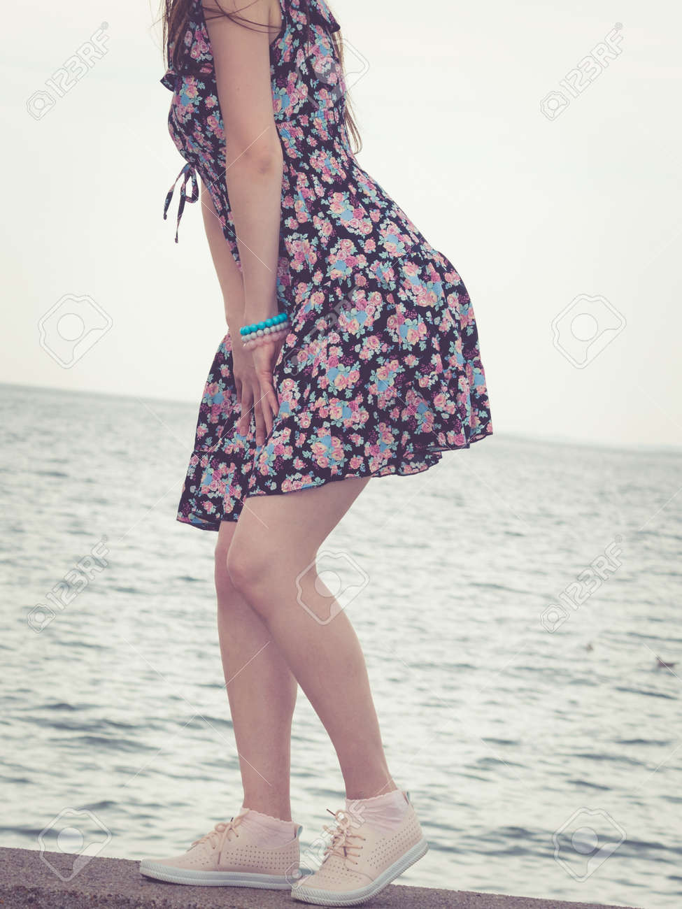 floral dress and white sneakers