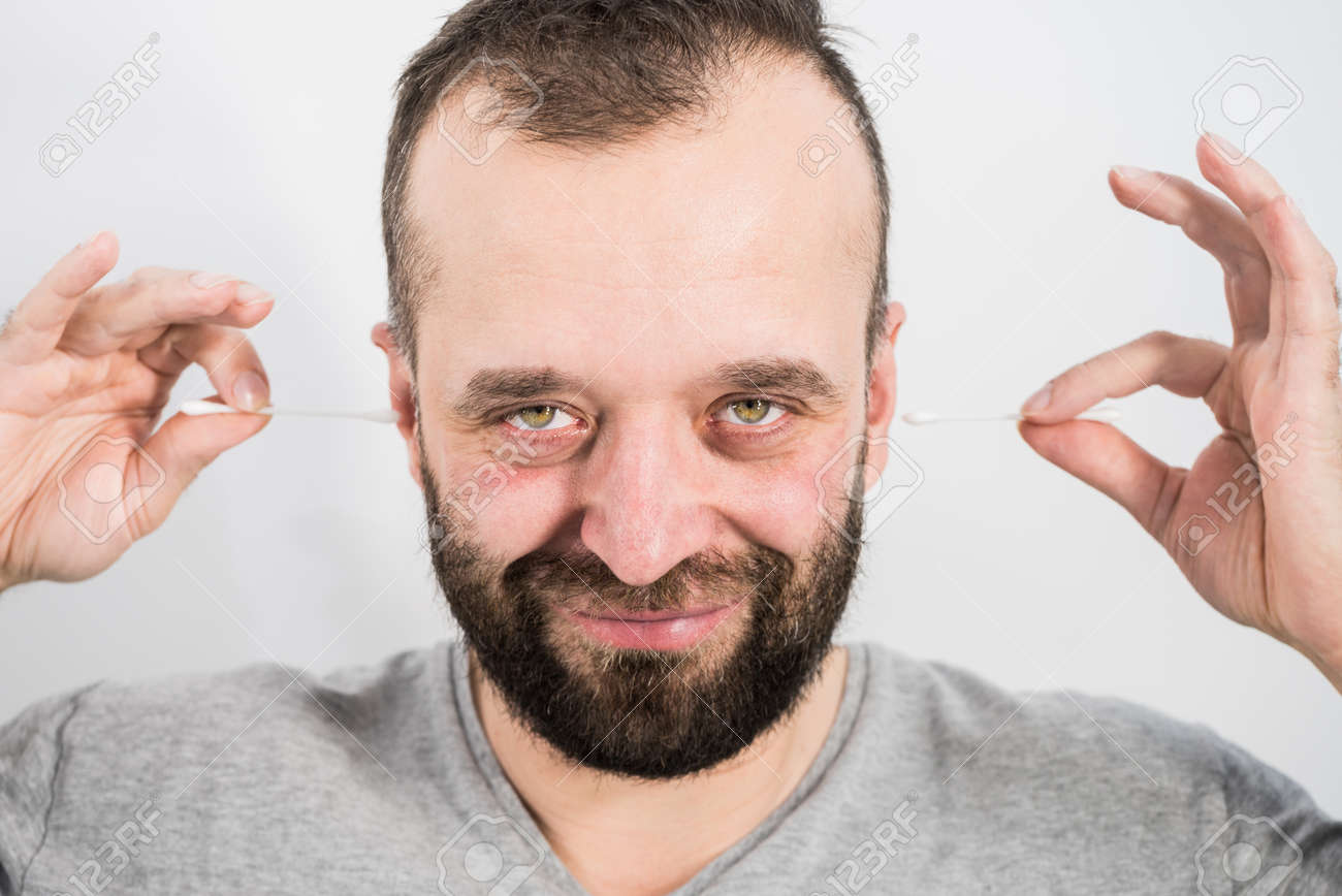 Man About To Clean His Ears Using Q Tip Cotton Swab Hygiene