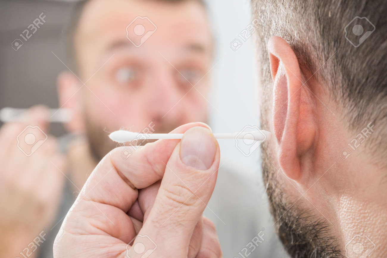 Man About To Clean His Ears Using Q Tip Cotton Swab Hygiene
