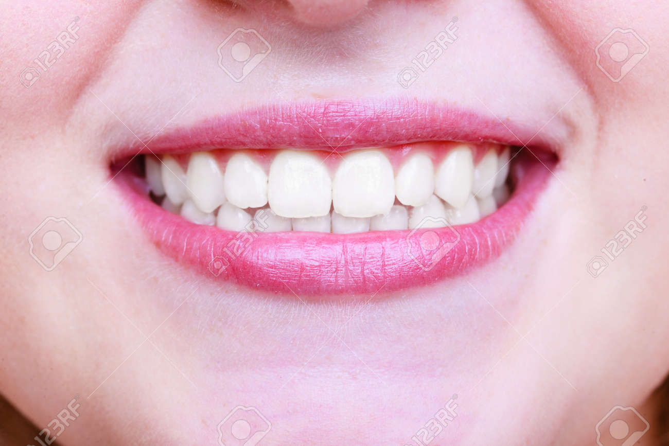 Young woman with healthy teeth. Dental care - 141105430 Young woman with healthy teeth. Dental care - 141105430