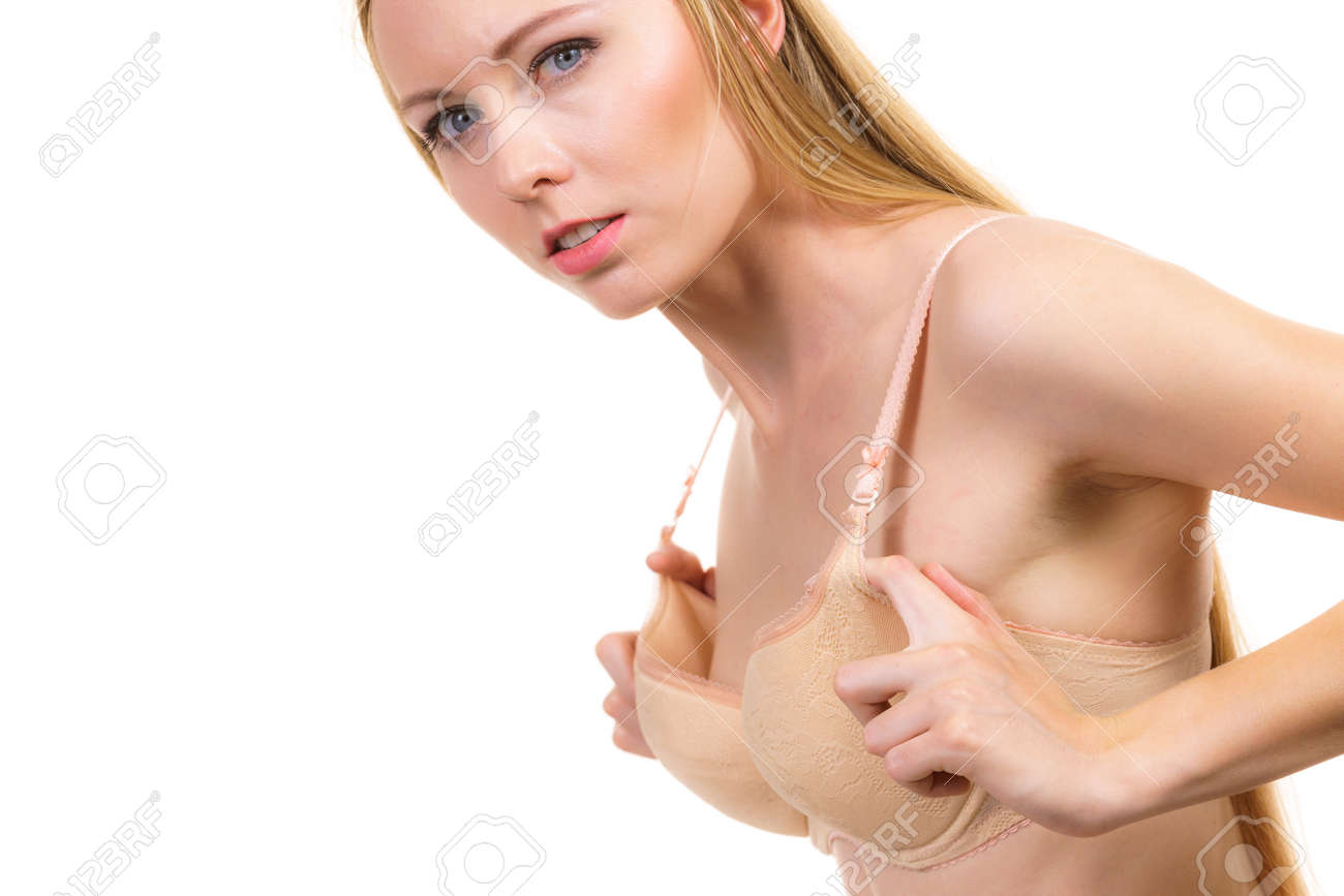 Young woman small wearing too big bra. Female wrong size lingerie. Bosom, brafitting concept. Breasts enlargement. - 164829889 Young woman small wearing too big bra. Female wrong size lingerie. Bosom, brafitting concept. Breasts enlargement. - 164829889