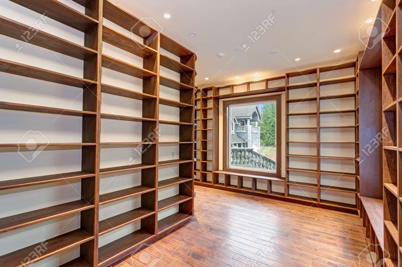 Traditional Style Library With Built-in Wrap-around Bookshelves In A New  Empty Mansion House. Stock Photo, Picture and Royalty Free Image. Image  91635163., image size:1300x866