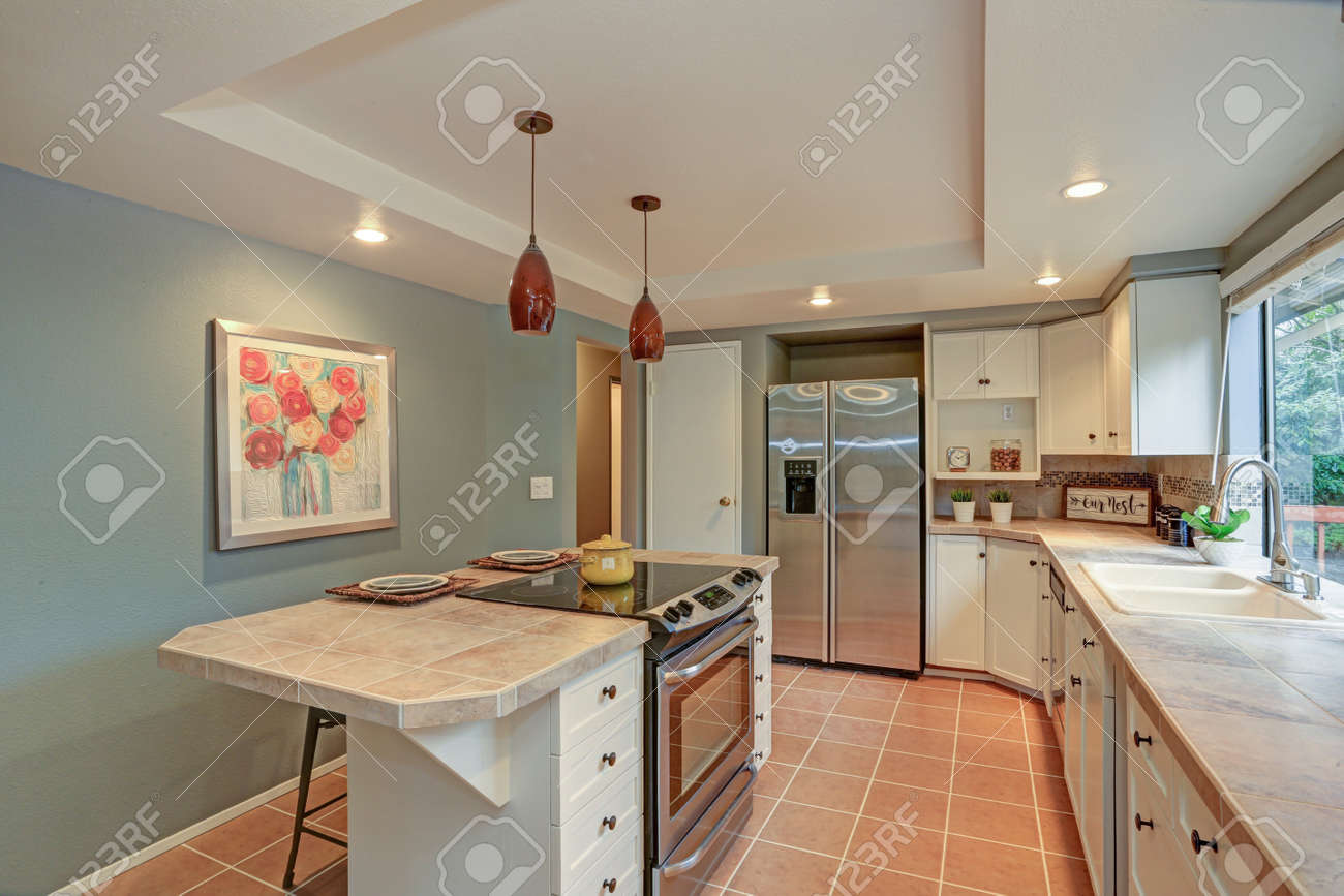 Second Floor Kitchen Boasts Tray Ceiling Island And White Shaker