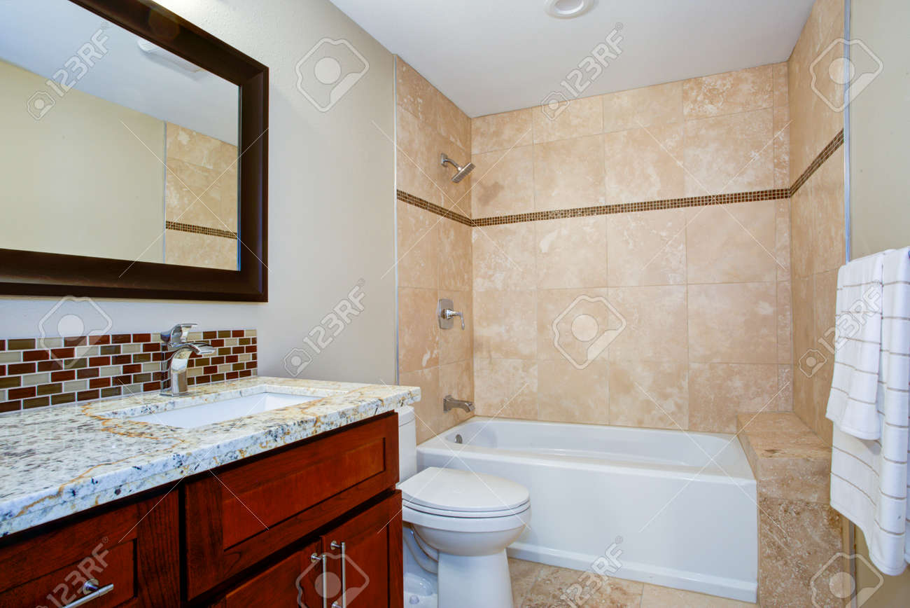 Elegant Bathroom With A Mahogany Stained Vanity With A Granite - Elegant Bathroom With A Mahogany Stained Vanity With A Granite