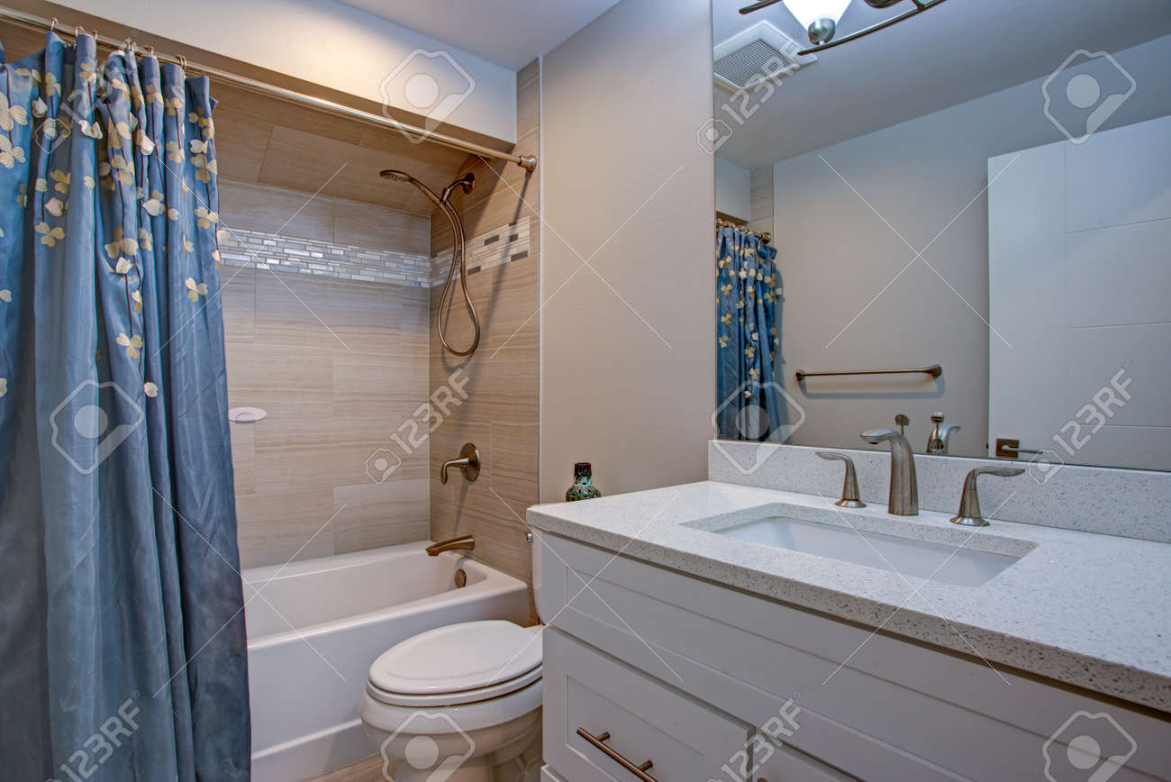 Perfectly Designed Bathroom With White Vanity Cabinet Tub And