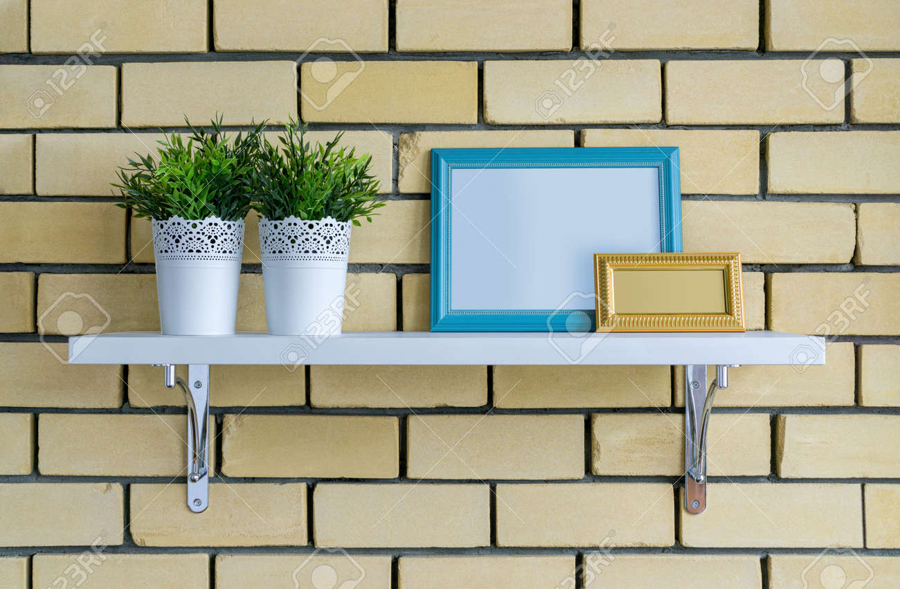 Download Two Wooden Frames And Flower Pots Of Greenery Stand On Shelf Stock Photo Picture And Royalty Free Image Image 136428874 PSD Mockup Templates