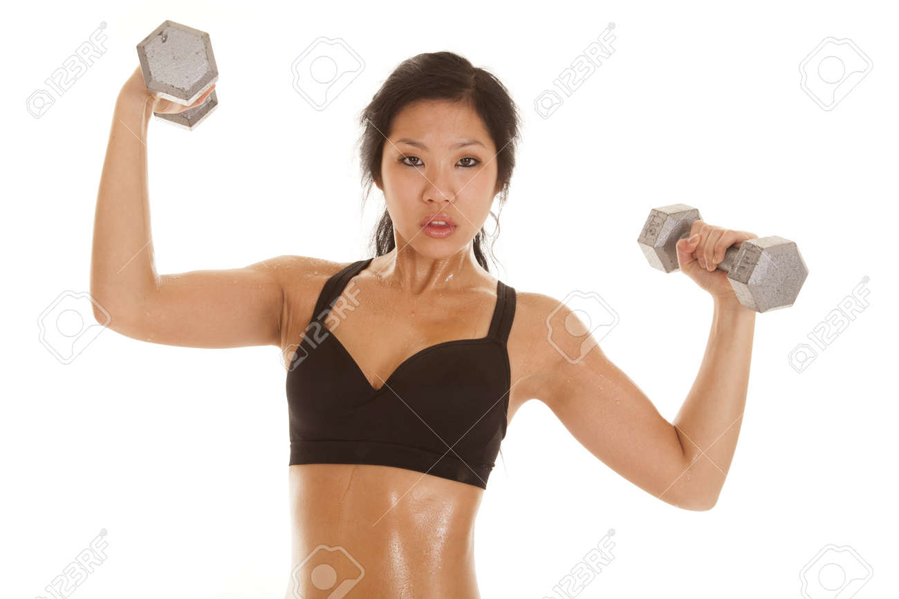 An Asian Woman In Her Black Sports Bra With Sweat Dripping Off Her Body  Lifting Weights. Stock Photo, Picture and Royalty Free Image. Image  18188009.