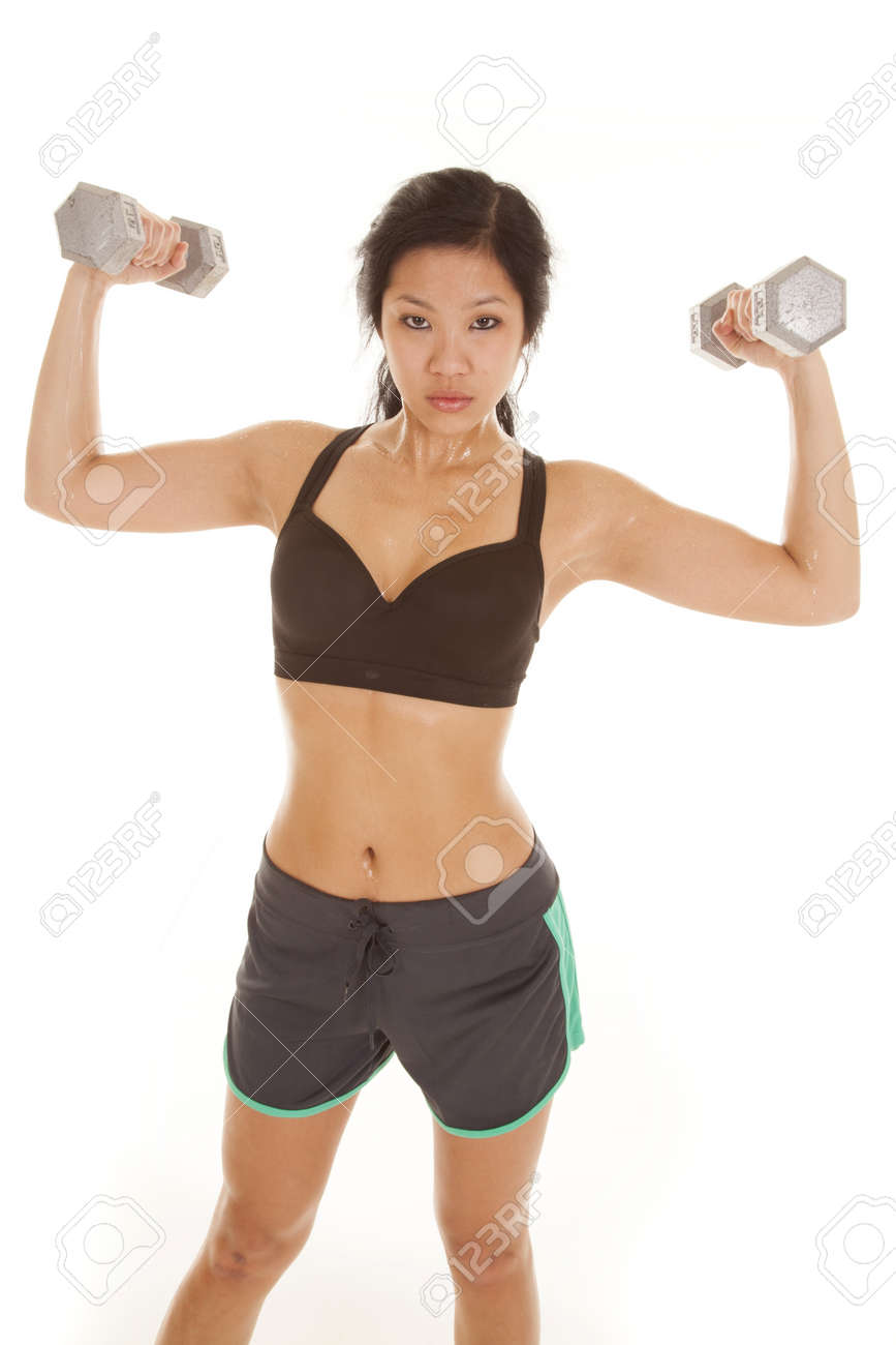 An Asian Woman With A Serious Expression On Her Face Lifting Weights And  Sweat Dripping Off Of Her Body. Stock Photo, Picture and Royalty Free  Image. Image 18187909.
