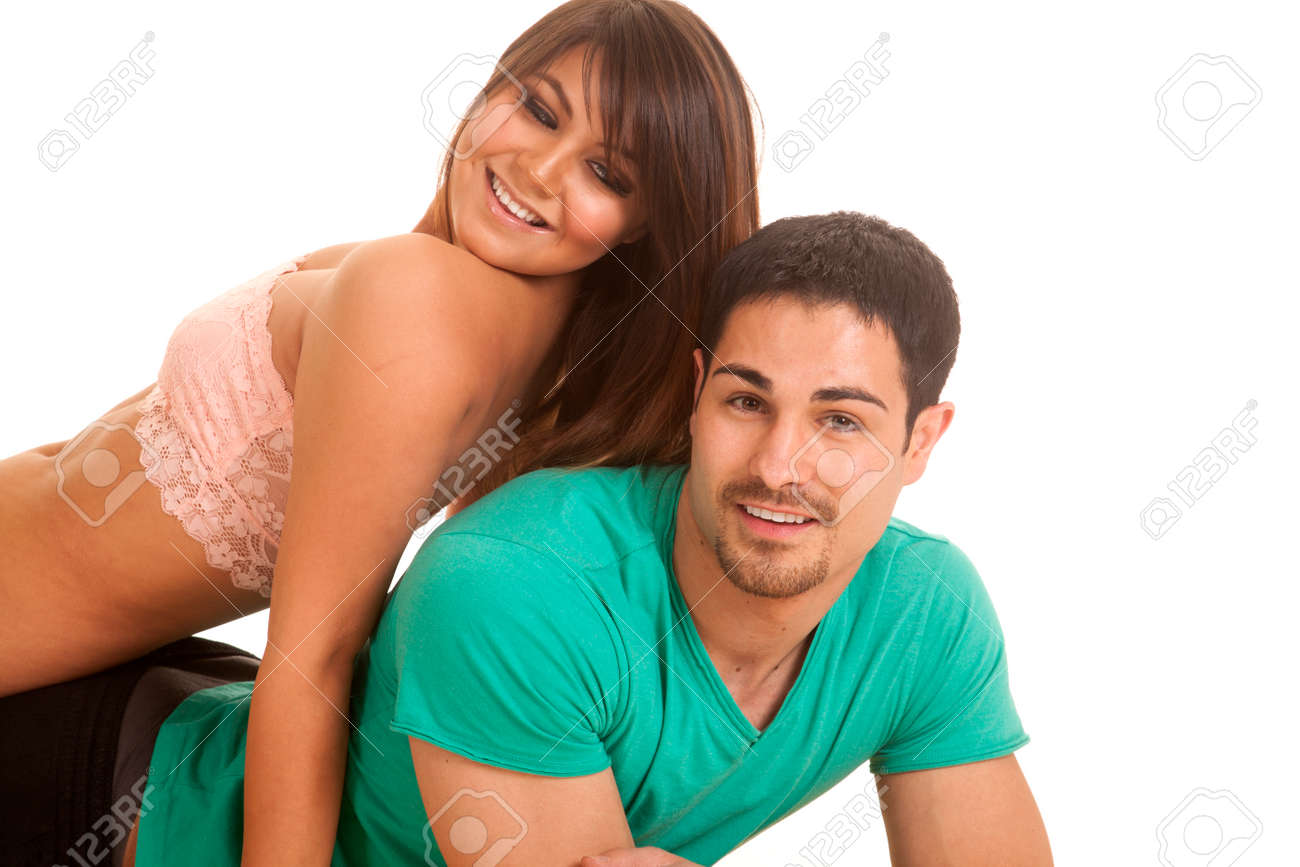 A Woman Laying On Her Man S Back Looking Down At Him Stock Photo Picture And Royalty Free Image Image 25130861