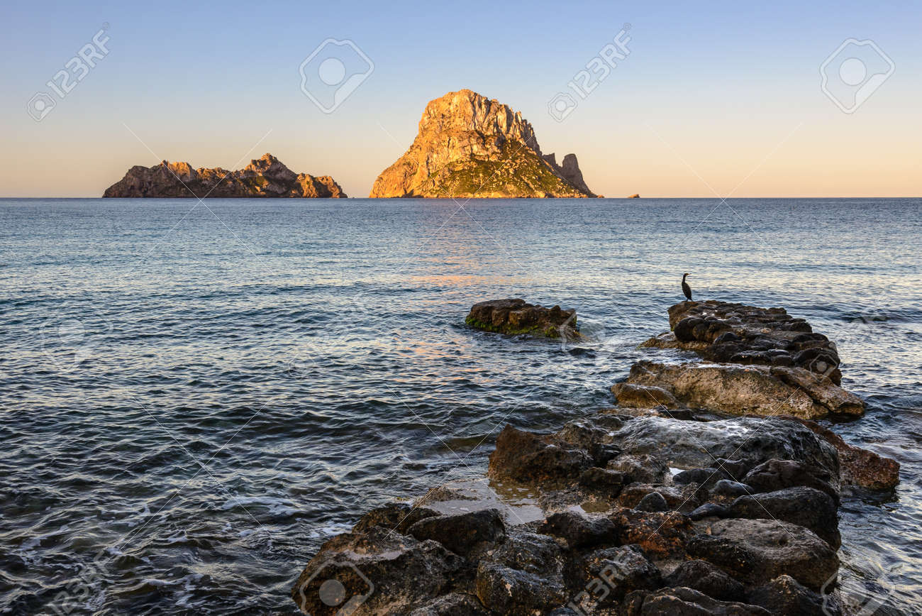 Cala Dhort Beach At Sunrise Es Vedra As Background Ibiza