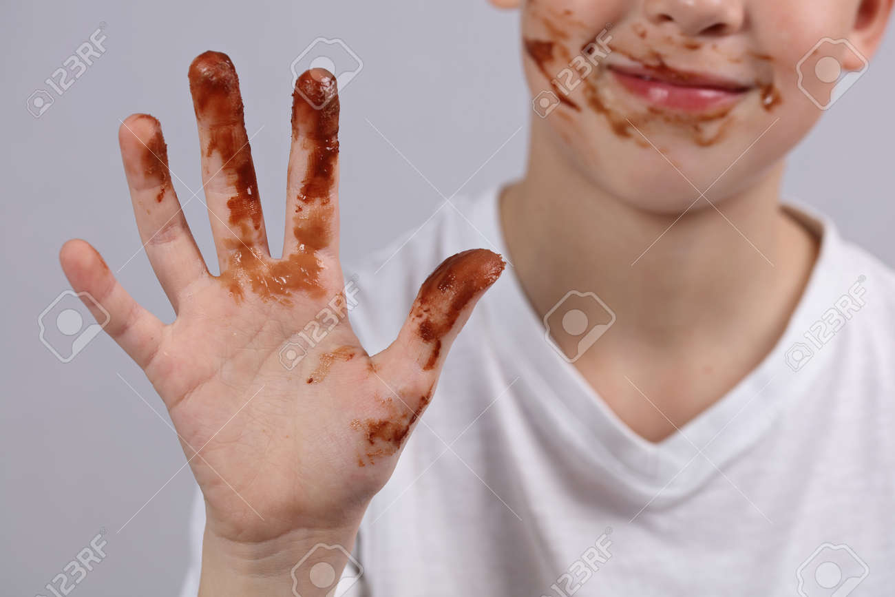 Child Showing Dirty Hands With Stains Of Chocolate Stock Photo, Picture And  Royalty Free Image. Image 77082058.